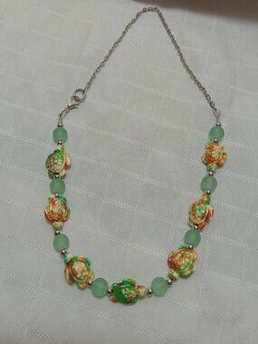 Pretty handmade necklace with  little turtles and glass bead